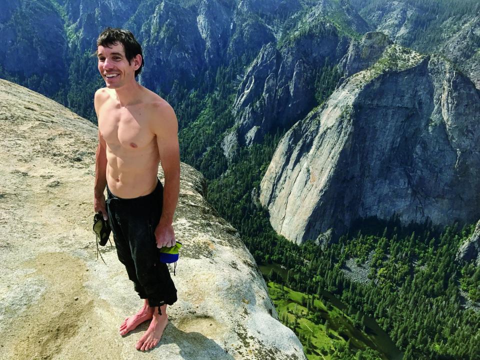 Holding all his climbing gear his shoes and bag of chalk Honnold stands atop El Capitan four hours after he began scaling it. "At the bottom, I was a little nervous," he said afterward. "I mean, it's a freaking-big wall above you." So what ís next? "I still want to climb hard things. Someday. You don't just retire as soon as you get down."(Jimmy Chin) ORG XMIT: NGM_0569895482 [Via MerlinFTP Drop]