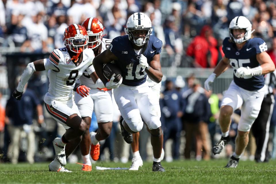 Sep 7, 2024; University Park, Pennsylvania, USA; Penn State Nittany Lions running back Nicholas Singleton (10) runs with the ball during the fourth quarter against the Bowling Green Falcons at Beaver Stadium. Penn State defeated Bowling Green 34-27. Mandatory Credit: Matthew O'Haren-Imagn Images