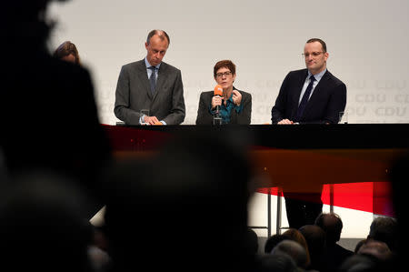 Christian Democratic Union (CDU) candidates Friedrich Merz, Annegret Kramp-Karrenbauer and Jens Spahn attend a regional conference in Luebeck, Germany, November 15, 2018. REUTERS/Fabian Bimmer