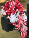 <p>Bursting with holiday spirit, this project is easier to make than it looks thanks to a helpful video.</p><p><strong>Get the tutorial at <a href="https://gracemonroehome.com/how-to-make-a-christmas-mailbox-swag/" rel="nofollow noopener" target="_blank" data-ylk="slk:Grace Monroe Home;elm:context_link;itc:0;sec:content-canvas" class="link ">Grace Monroe Home</a>.</strong></p><p><strong><a class="link " href="https://www.amazon.com/Darice-1619-61-10-Piece-Snowflake-Ornament/dp/B00GFW45TE/ref=asc_df_B00GFW45TE/?tag=syn-yahoo-20&ascsubtag=%5Bartid%7C10050.g.33605249%5Bsrc%7Cyahoo-us" rel="nofollow noopener" target="_blank" data-ylk="slk:SHOP PLASTIC SNOWFLAKES;elm:context_link;itc:0;sec:content-canvas">SHOP PLASTIC SNOWFLAKES</a><br></strong></p>