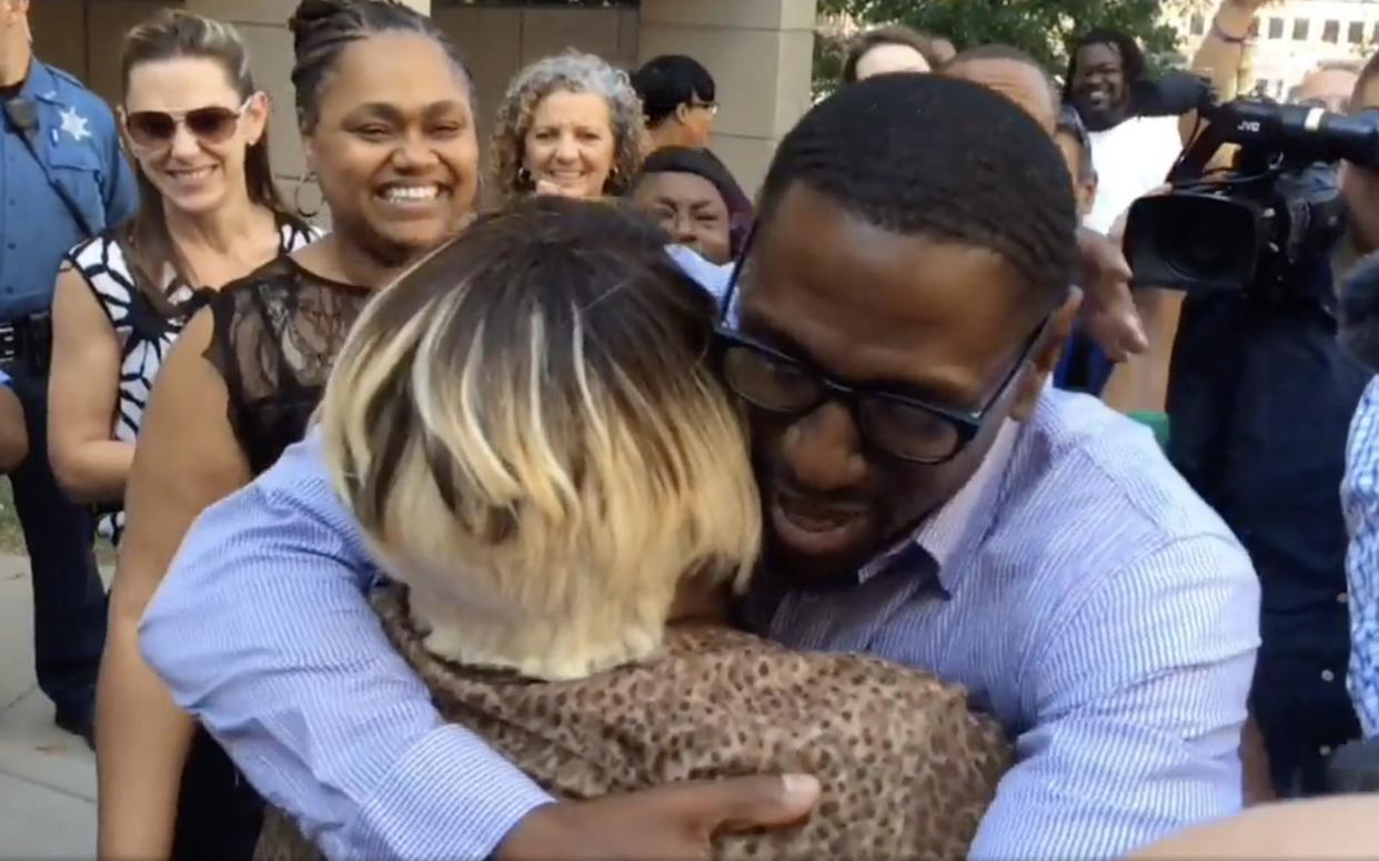 Lamonte McIntyre hugging a family member after being released from prison following being wrongly imprisoned 23 years for double murder
