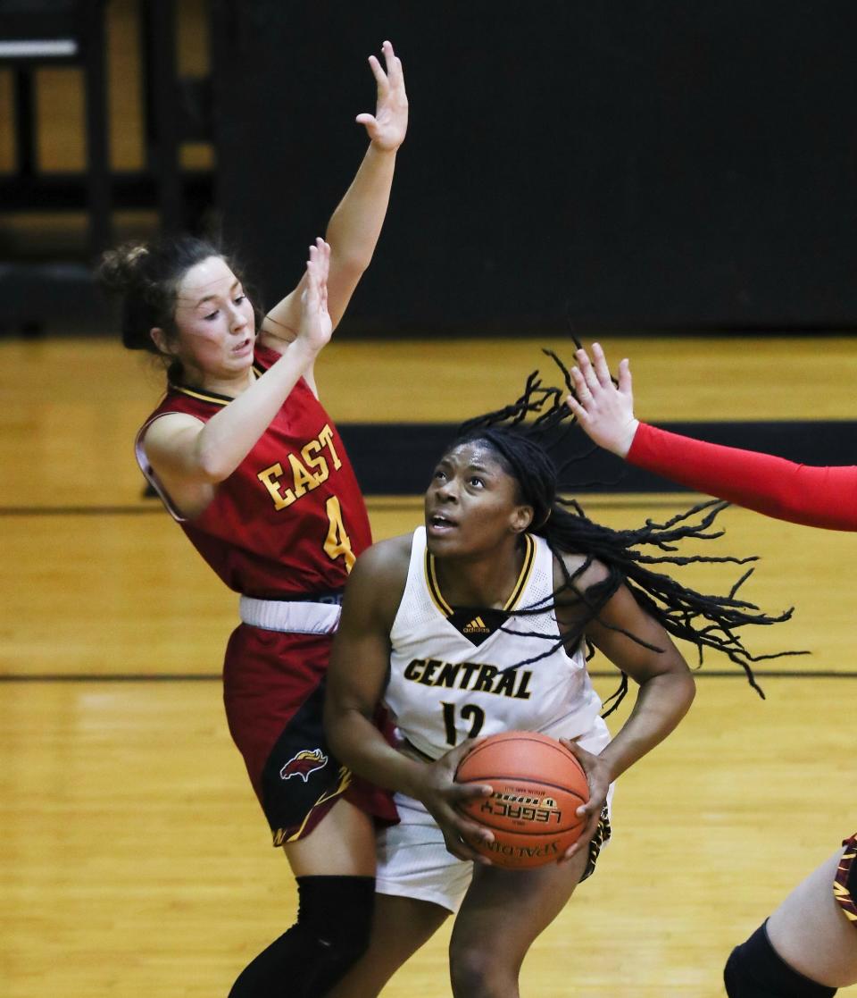Central’s Destiny Jones (12) looked to score against Bullitt East’s Logan Ortega (4) during their game at the Central High School in Louisville, Ky. on Jan. 11, 2022.  Jones finished with 20 points, but Bullitt East won 63-52.