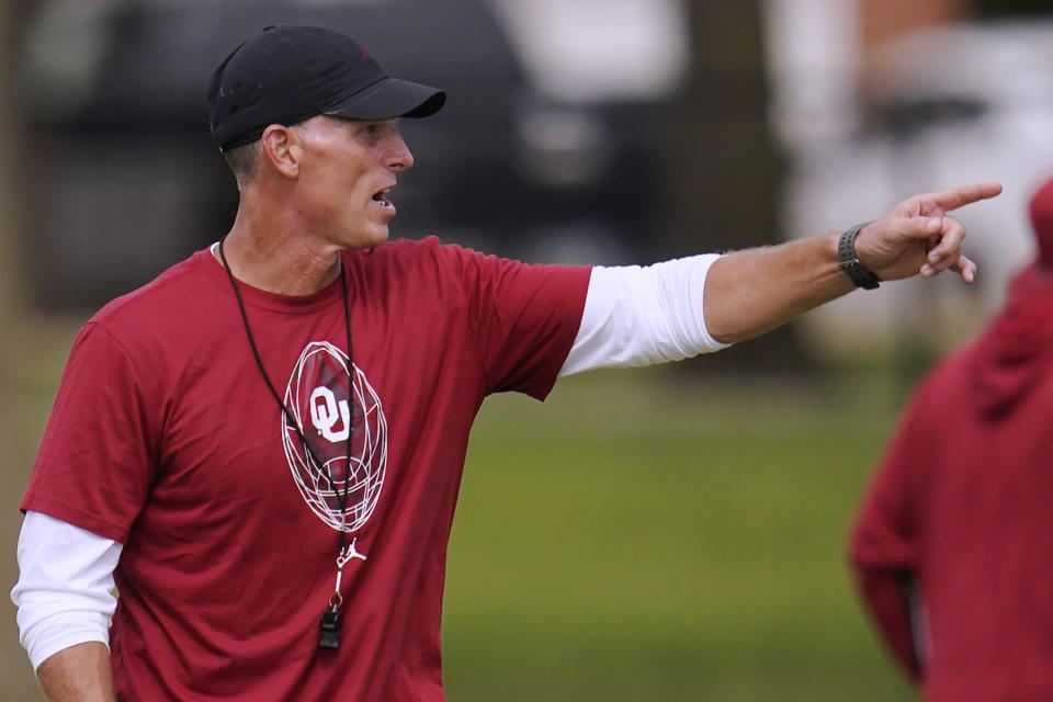 Oklahoma coach Brent Venables gestures during the team's NCAA college football practice Tuesday, Aug. 16, 2022, in Norman, Okla. (AP Photo/Sue Ogrocki)