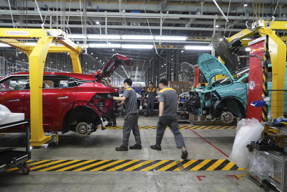 Workers assemble electric cars at a Vinfast factory in Hai Phong, Vietnam, on Sept. 29, 2023. Vietnamese automaker VinFast just can’t sell enough cars, so it's hoping its tiniest and cheapest car yet — a roughly 10-foot-long mini-SUV priced at $9,200 and called the VF3 — will become Vietnam's “national car" and win over consumers in Asian markets. (AP Photo/Hau Dinh)