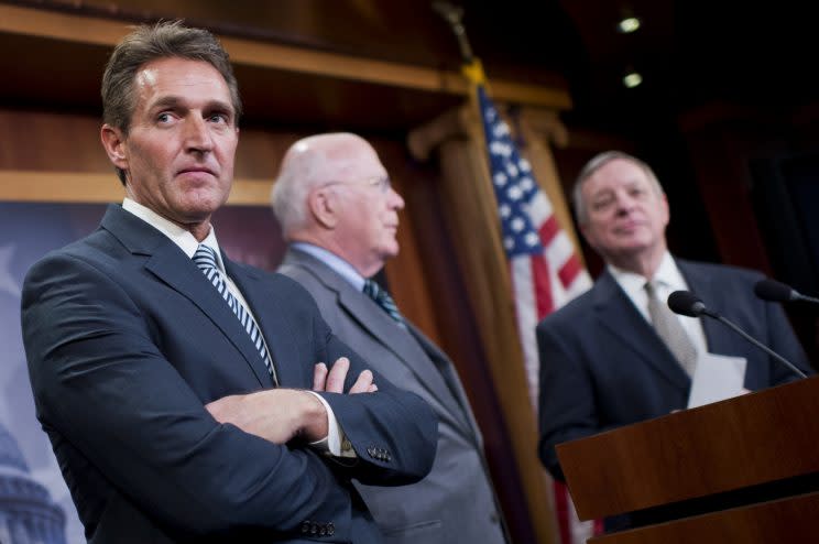 From left, Jeff Flake, R-Ariz., Patrick Leahy, D-Vt., and Minority Whip Richard Durbin, D-Ill., conduct a news conference in the Capitol's Senate studio on legislation that would end the U.S. travel ban on Cuba, January 29, 2015. (Photo: Tom Williams/CQ Roll Call)