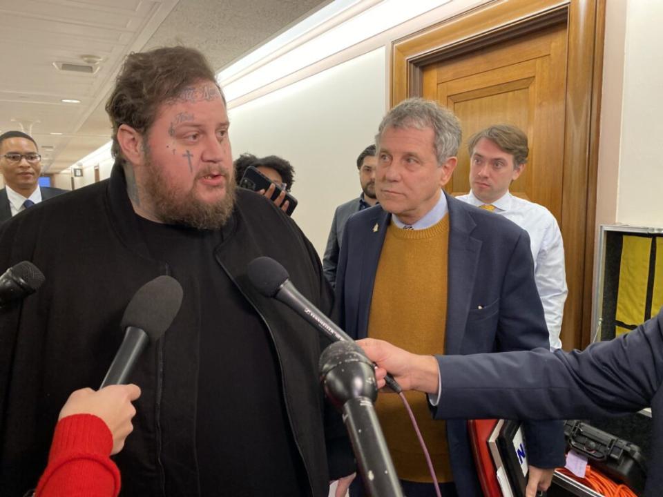 Jason “Jelly Roll” DeFord, a country musician, speaks to reporters alongside Ohio Democratic Sen. Sherrod Brown before testifying in front of the U.S. Senate Banking Committee about the fentanyl crisis on Thursday, Jan. 11, 2024. (Photo by Jennifer Shutt/States Newsroom)