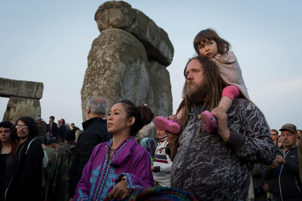 <p>Spiritual revellers celebrate the summer solstice (mid-summer and longest day) at the ancient stones of Stonehenge, on 21st June 2017, in Wiltshire, England. (Photo: Richard Baker/In Pictures via Getty Images) </p>