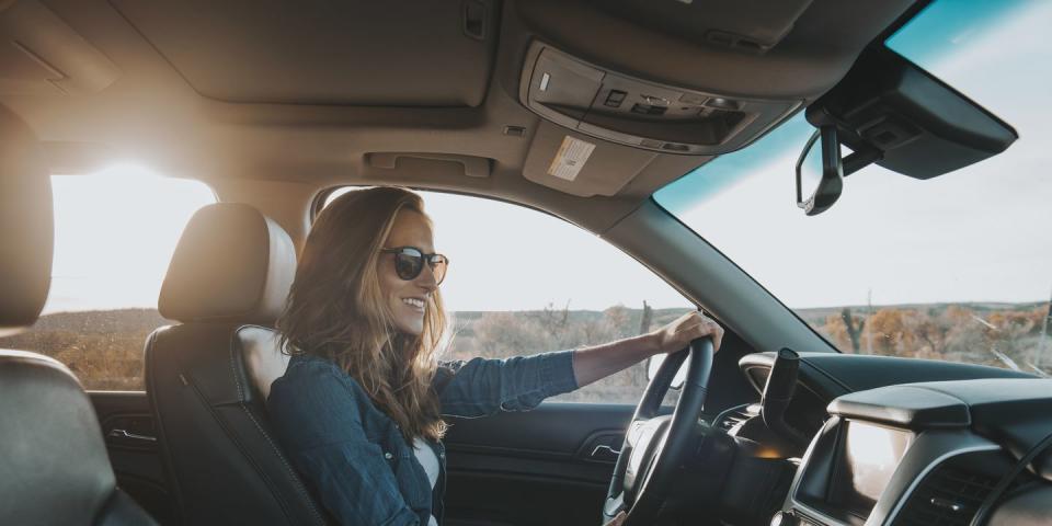 single woman driving a car