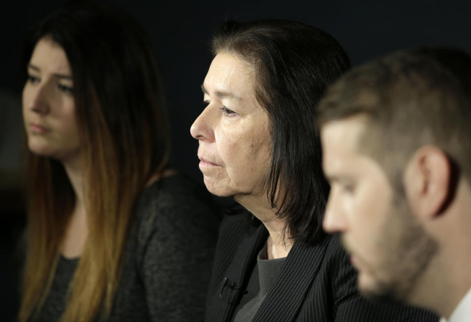 FILE - In this Jan. 18, 2016, file photo, Christine Levinson, center, wife of Robert Levinson, and her children, Dan and Samantha Levinson, talk to reporters in New York. The family of Robert Levinson, who went missing in Iran a decade ago on an unauthorized CIA assignment, filed a lawsuit Tuesday, March 21, 2017, against Iran. The lawsuit in U.S. federal court describes in detail offers by Iran to “arrange” for his release in exchange for a series of concessions, including for the return of a Revolutionary Guard general who defected to the West. (AP Photo/Seth Wenig, File)
