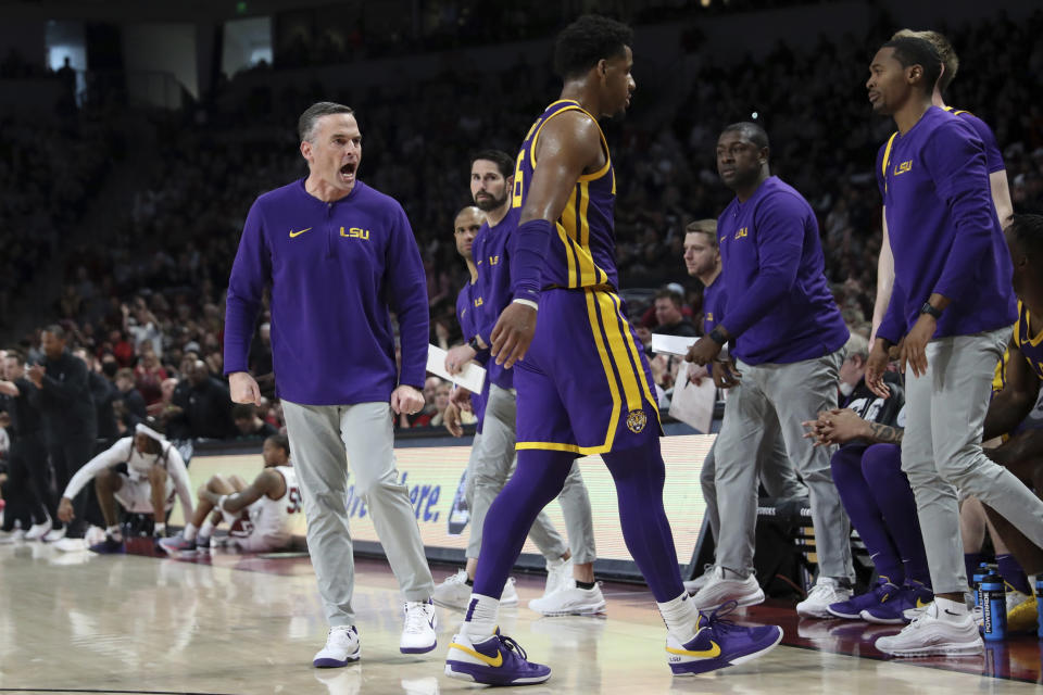 LSU head coach Matt McMahon has a few words with guard Jordan Wright (6) during the first half of an NCAA college basketball game against South Carolina Saturday, Feb. 17, 2024, in Columbia, S.C. (AP Photo/Artie Walker Jr.)