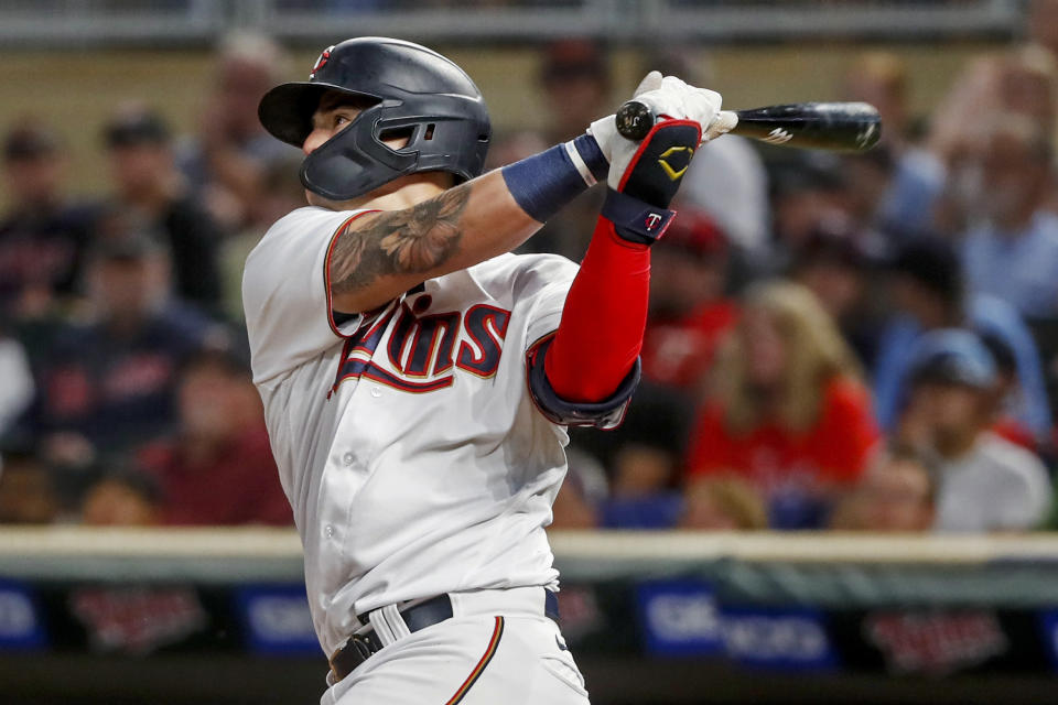 Minnesota Twins' Jose Miranda watches a solo home run against the Toronto Blue Jays during the sixth inning of a baseball game Saturday, Aug. 6, 2022, in Minneapolis. (AP Photo/Bruce Kluckhohn)