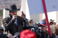 FILE - In this Friday, Jan. 31, 2020 file photo, Otero County Commissioner Couy Griffin speaks in Santa Fe, N.M., during a gun rights rally. Griffin, who founded the group “Cowboys for Trump,” entered the Capitol grounds in Washington on Jan. 6, 2021, then kept posting on Parler about his support for continuing the fight and told his fellow county commissioners that he planned to attend the inauguration armed. (AP Photo/Morgan Lee)