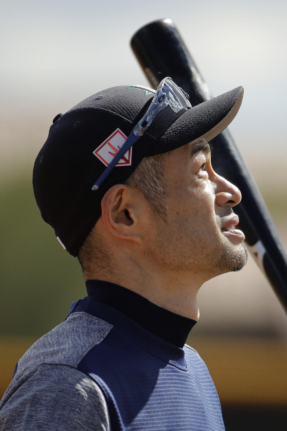 Seattle Mariners' Ichiro Suzuki waits to take batting practice during spring training baseball practice Saturday, Feb. 16, 2019, in Peoria, Ariz. (AP Photo/Charlie Riedel)