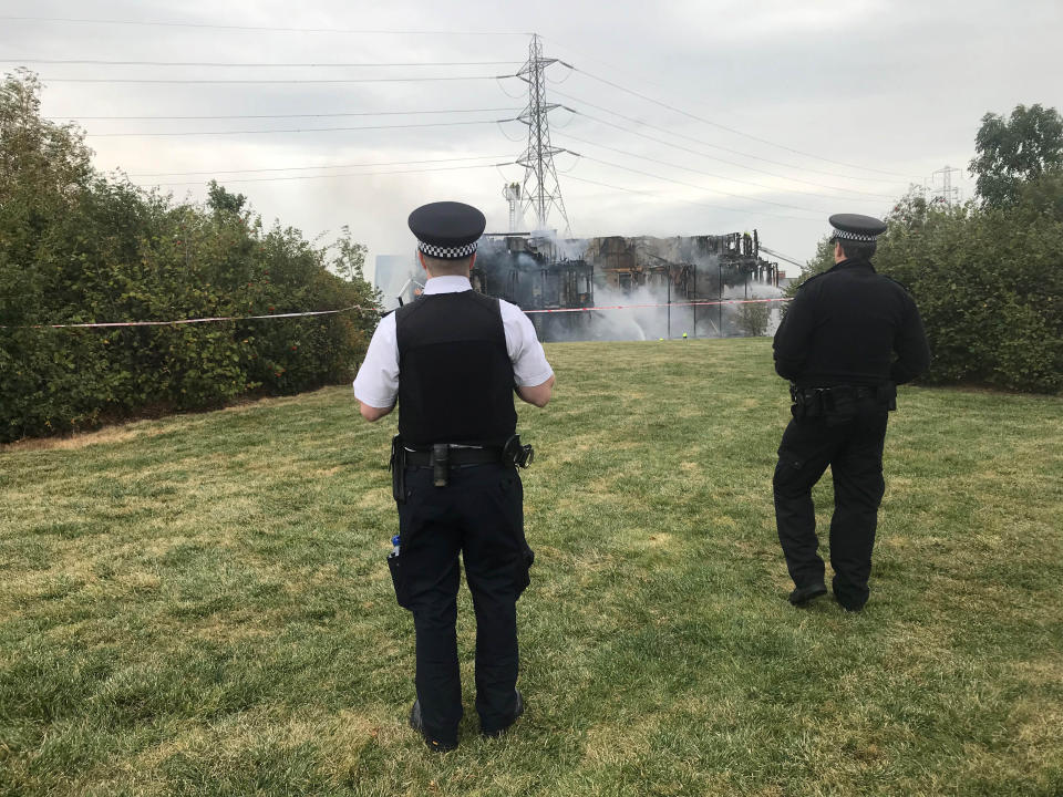 Police at the scene of a fire at a four-storey block of flats in Sherbrooke Way, Worcester Park, south-west London (Picture: PA)