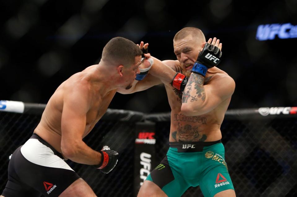 Nate Diaz (left) and Conor McGregor engaged in a war in their second meeting (Getty Images)