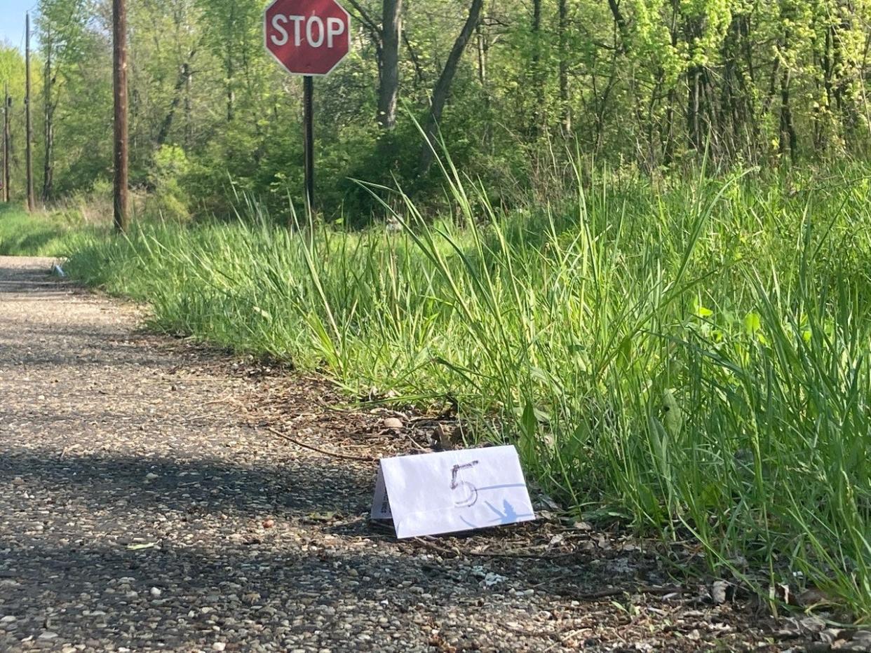 Evidence markers spanned an entire block along Hardington Avenue NE near 12th Street NE in Canton Township.