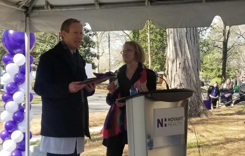 Cathy Bessant was honored Tuesday during a ceremony hosted by Novant Health on Tuesday. She is with Dr. Peter Turk, who will chair a new endowment bearing her name.