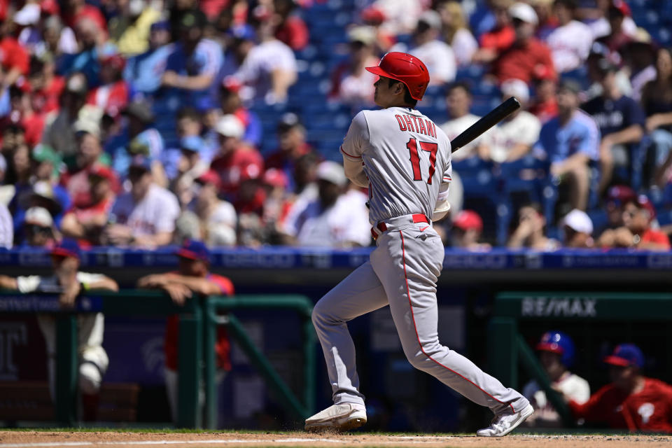 Los Angeles Angels' Shohei Ohtani watches the ball after hitting a double off Philadelphia Phillies starting pitcher Kyle Gibson during the fourth inning of a baseball game, Sunday, June 5, 2022, in Philadelphia. (AP Photo/Derik Hamilton)