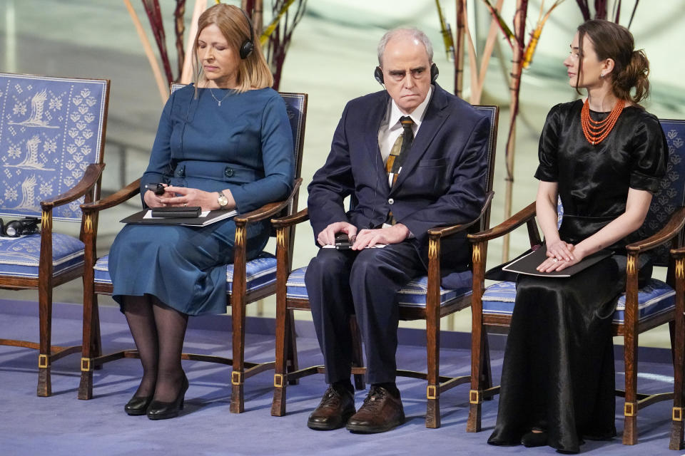 From left: Natallia Pintsyuk, representing her husband, the jailed activist Ales Bialiatski from Belarus, Jan Rachynskij, representing the Russian organization Memorial and Oleksandra Matviytsyuk, representing the Ukrainian organization Center for Civil Liberties (CCL) during the awarding of the Nobel Peace Prize for 2022 in Oslo town hall, Saturday, Dec. 10, 2022. (Rodrigo Freitas/NTB Scanpix via AP)