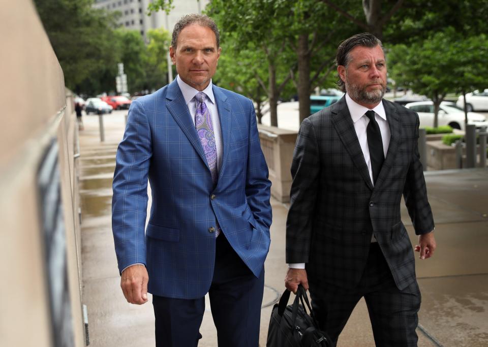 Businessman John Rallo, left, and his lawyer John Rogers arrive at federal court in St. Louis on Tuesday, July 16, 2019. Rallo has admitted in federal court that he provided bribes as part of former St. Louis County Executive Steve Stenger's pay-to-play scheme, the fourth person to plead guilty in connection with the crime. Rallo pleaded guilty Tuesday, June 16, 2019 to three counts of bribery. (David Carson/St. Louis Post-Dispatch via AP)