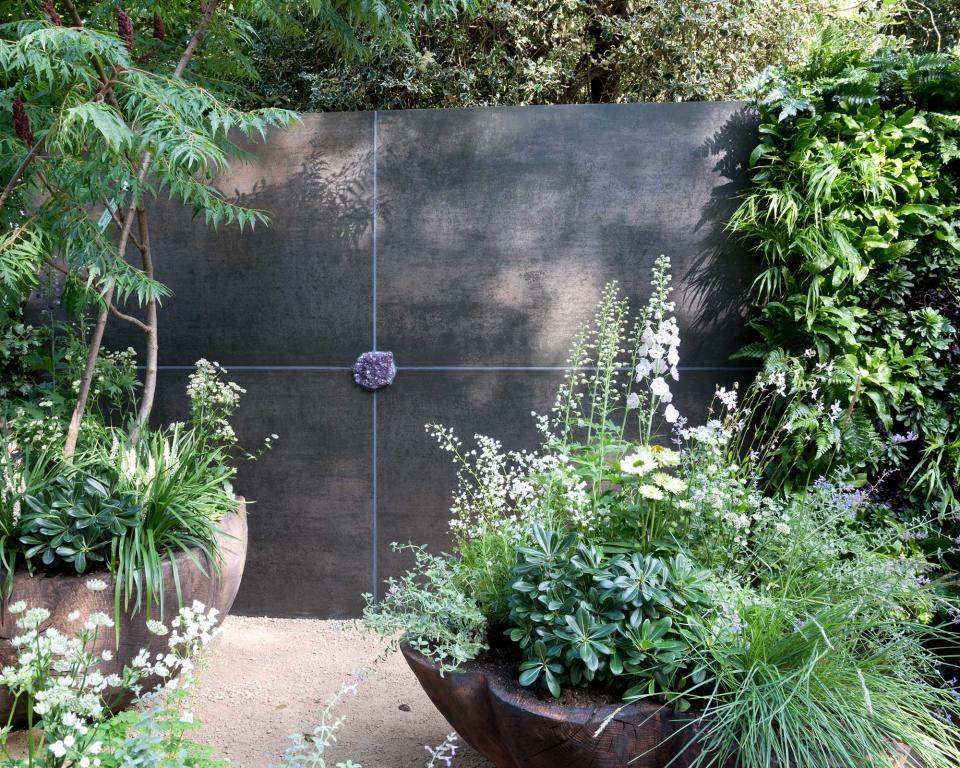<p> Garden walls are a staple feature in landscaping ideas, dividing one zone to the next, screening off less-than-sightly views, and providing shelter for seating spaces or more tender plants. But, practical as they may be, walls can also be a stylish statement for your plot and help pull together a theme. </p> <p> Take this design for instance, which brings a striking, contemporary backdrop to oversized containers brimming with plants. Living walls are another option – and are perfect for getting more greenery into a smaller space.  </p> <p> Or, how about a wall water feature? They are having a real moment right now in garden design and it's easy to see why. </p>
