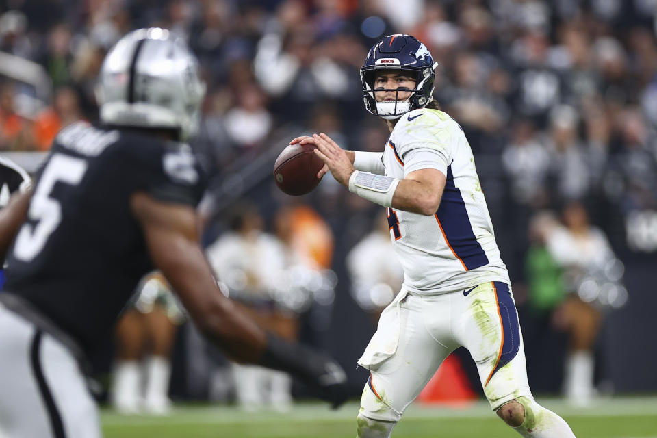 Denver Broncos quarterback Jarrett Stidham throws a pass against the Las Vegas Raiders during the second half of an NFL football game, Sunday, Jan. 7, 2024 in Las Vegas. (AP Photo/Ellen Schmidt)