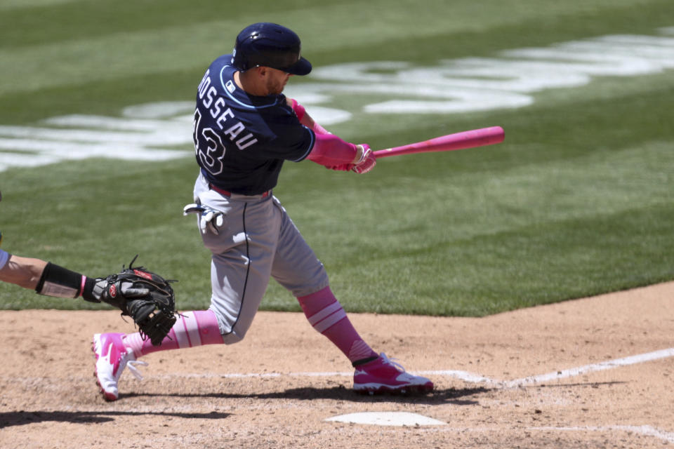 Tampa Bay Rays' Mike Brosseau hits a solo home run against the Oakland Athletics during the sixth inning of a baseball game in Oakland, Calif., Sunday, May 9, 2021. (AP Photo/Jed Jacobsohn)