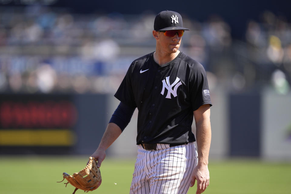 New York Yankees third baseman DJ LeMahieu walks on the field after getting injured during the third inning of a spring training baseball game against the Minnesota Twins Monday, Feb. 26, 2024, in Tampa, Fla. (AP Photo/Charlie Neibergall)