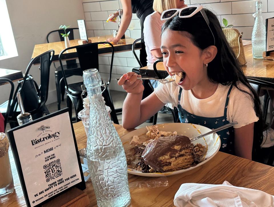 Nine-year-old Isabella Alvarez of New York enjoys her Nutella pancakes at Bistrology earlier this year. She was here with her family on vacation. They found the restaurant listed on Google.