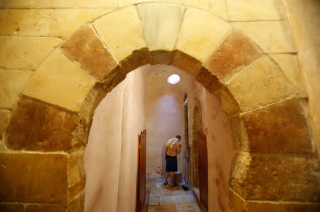 A Palestinian man is seen at As-Samra bath house in Gaza City. REUTERS/Suhaib Salem