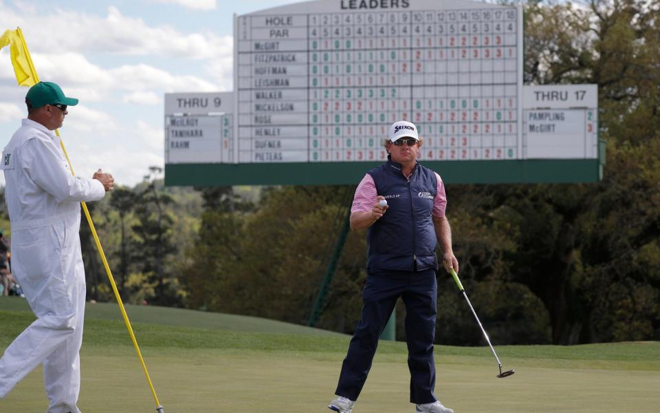 William McGirt of the U.S. finishes his round with caddie Brandon Antus during first round play at the 2017 Masters - Credit: REUTERS