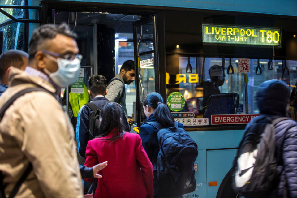 Commuters get on a Sydney bus. Scientists believe enclosed spaces like on public transport are more dangerous than first thought.