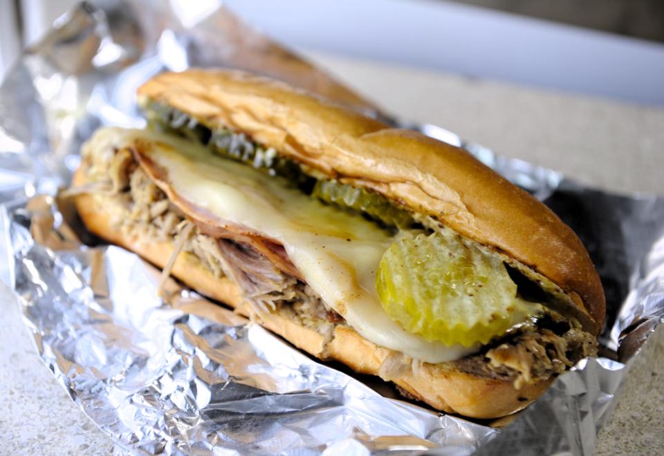 A Cuban sandwich with slow roasted pork, ham, cheese, pickle and creamy mustard sauce on a toasted hoagie roll from Jenn's Rockin Eats on Thursday, Sept. 21, 2023.
