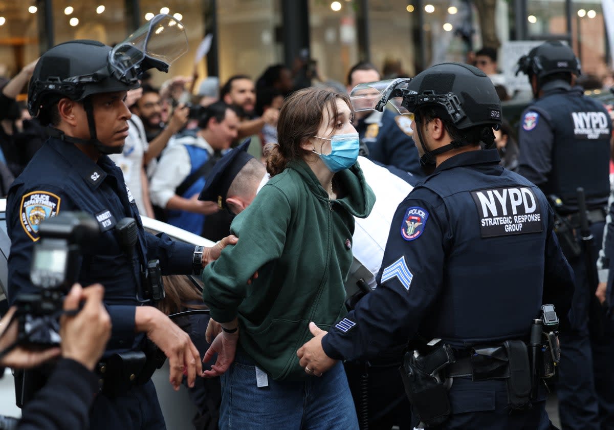 Police arrest a pro-Palestinian demonstrator near the Met Gala (AFP via Getty Images)