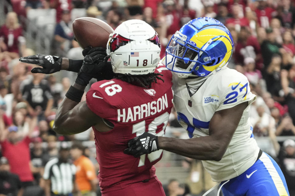 Arizona Cardinals wide receiver Marvin Harrison Jr. (18) makes a touchdown catch agaimnst Los Angeles Rams cornerback Tre'Davious White (27) during the first half of an NFL football game, Sunday, Sept. 15, 2024, in Glendale, Ariz. (AP Photo/Rick Scuteri)