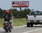 <p>A billboard advertising the Powerball jackpot stands in Bellevue, Neb., Aug. 23, 2017. Lottery officials said the grand prize for Wednesday night’s drawing has reached $700 million. The second -largest on record for any U.S. lottery game. (Photo: Nati Harnik/AP) </p>