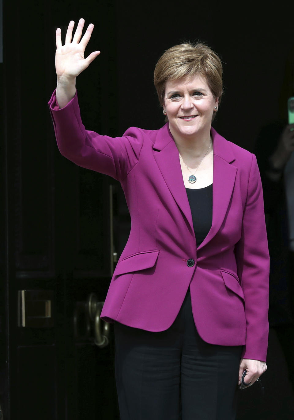 Scotland's First Minister and Scottish National Party leader Nicola Sturgeon poses for photographers, at Bute House in Edinburgh, Scotland. Sunday, May 9, 2021. British Prime Minister Boris Johnson has invited the leaders of the U.K.’s devolved nations for crisis talks on the union after Scotland’s pro-independence party won its fourth straight parliamentary election. Sturgeon said the election results proved a second independence vote for Scotland was “the will of the country." She said any London politician who stood in the way would be “picking a fight with the democratic wishes of the Scottish people.” (AP Photo/Scott Heppell)