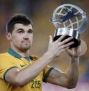 Australia's goalkeeper Mathew Ryan holds up his trophy for best goalkeeper during the trophy presentation ceremony of the Asian Cup at the Stadium Australia in Sydney January 31, 2015. REUTERS/Tim Wimborne