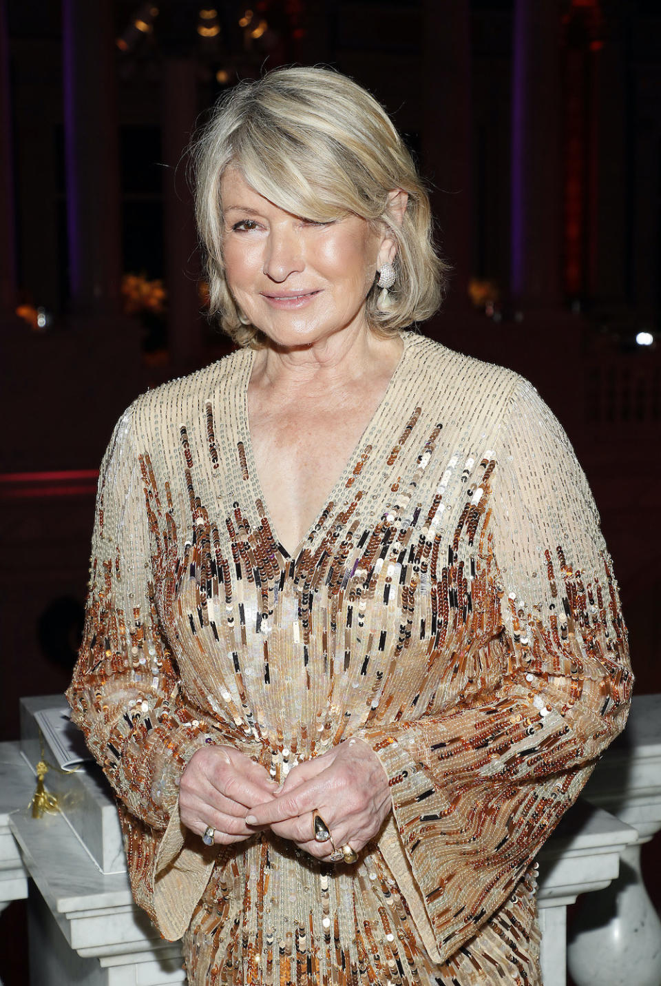 Martha in a beaded, long-sleeved, V-neck outfit