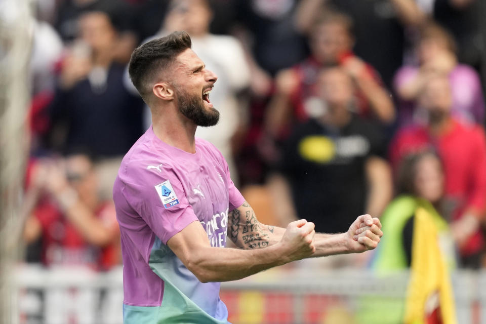 AC Milan's Olivier Giroud celebrates after scoring his side's second goal during the Serie A soccer match between AC Milan and Lecce at the San Siro stadium, in Milan, Italy, Saturday, April 6, 2024. (AP Photo/Antonio Calanni)