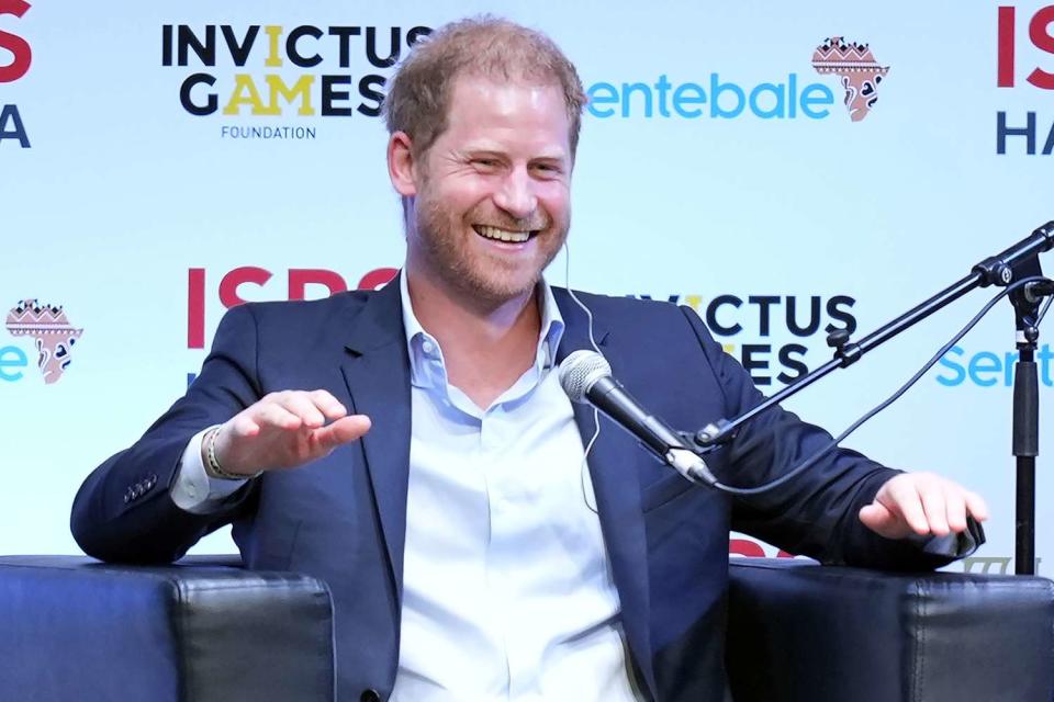 <p>AP Photo/Eugene Hoshiko</p> Prince Harry all smiles at the sports conference in Japan