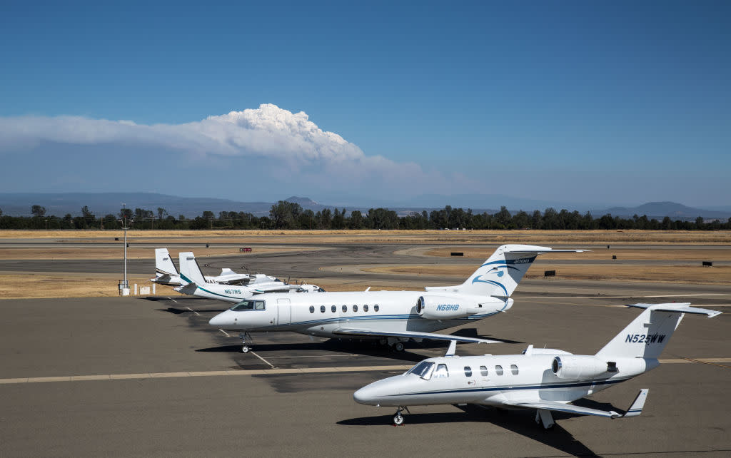 The destructive Dixie Fire can be seen from the airport on August 4, 2021, in Redding, California.