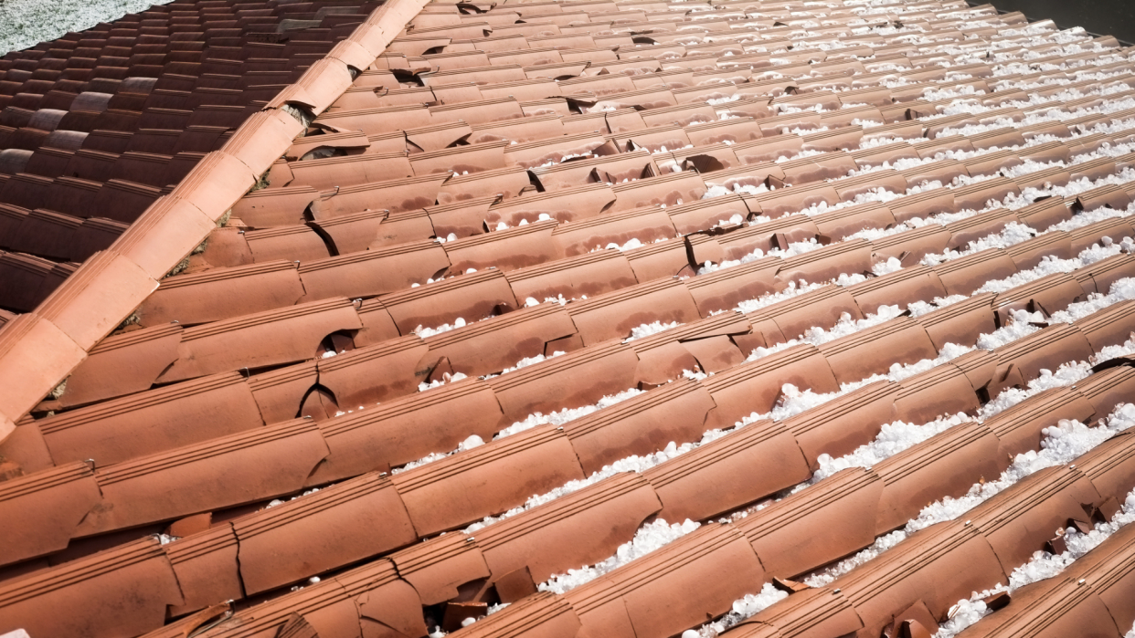 Hail can instantly damage your home, causing cracked or broken roofing tiles, for example.