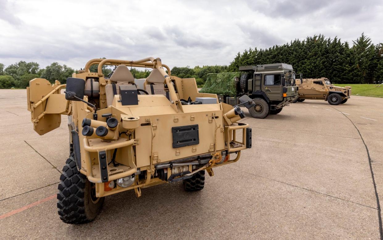 Hybrid experimental prototypes of the Army'€s Foxhound (rear), Jackal (front) and MAN SV vehicles - Sergeant Ben Beale