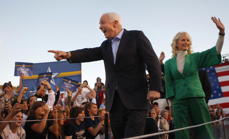 Republican presidential nominee John McCain, left, and his wife, Cindy, arrive at a campaign rally in Durango, Colorado, in October 2008.&nbsp; (Photo: Brian Snyder/Reuters)