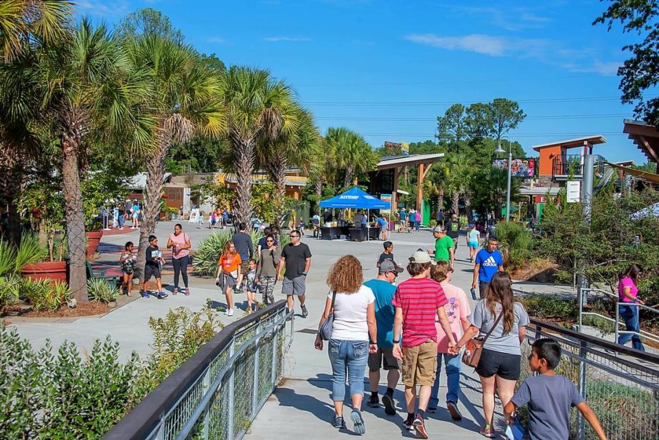 Crowds walk through Riverbanks Zoo and Garden in Columbia.