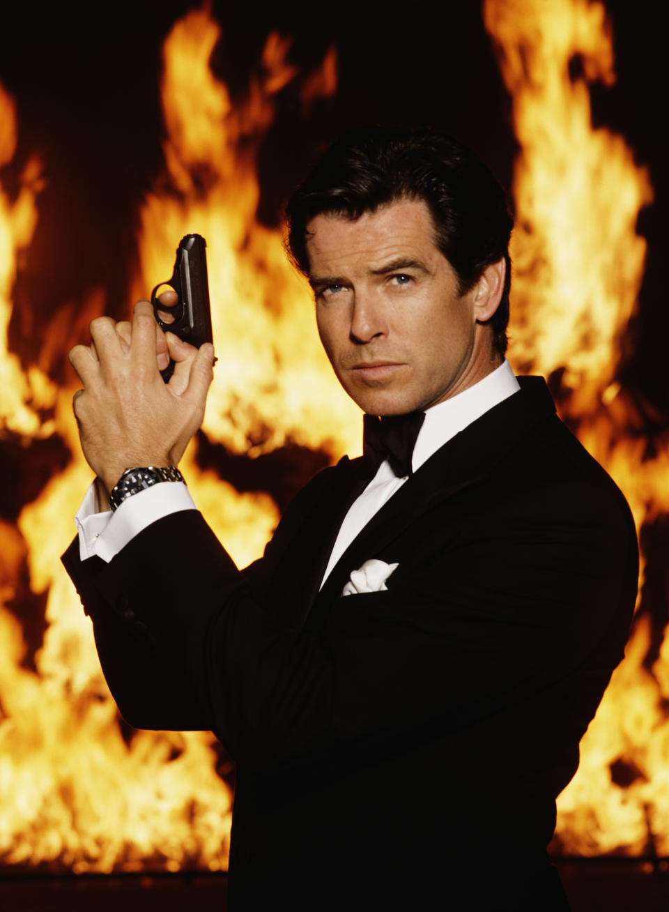 Irish actor Pierce Brosnan stars as James Bond in the film 'GoldenEye', 1995. He is holding his iconic Walther PPK. (Photo by Keith Hamshere/Getty Images)