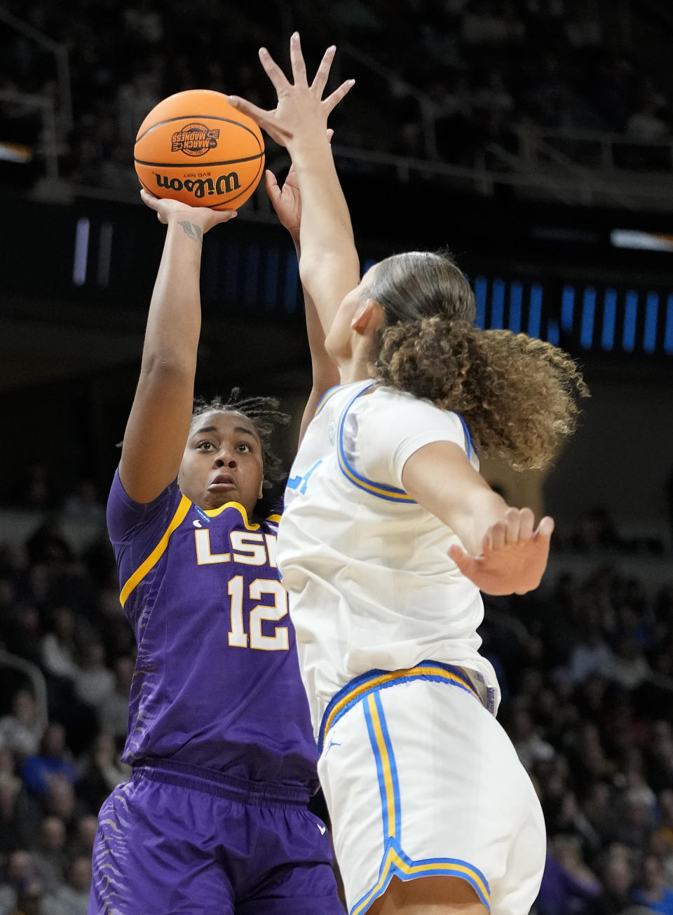 LSU guard Mikaylah Williams (12) shoots against UCLA center Lauren Betts (51) during the second quarter of a Sweet Sixteen round college basketball game during the NCAA Tournament, Saturday, March 30, 2024, in Albany, N.Y. (AP Photo/Mary Altaffer)