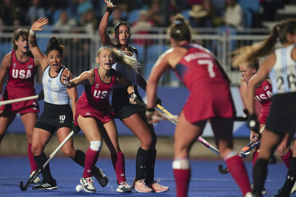 Danielle Grega of the United States, center, and Argentina's Maria Granatto, left, react during the women's field hockey gold medal match at the Pan American Games in Santiago, Chile, Saturday, Nov. 4, 2023. (AP Photo/Dolores Ochoa)