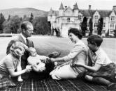 Britain's Queen Elizabeth II (2R) and her husband Prince Philip (2L) with their children Princess Anne (L), Prince Charles (R) and Prince Andrew (3L) at Balmoral in Scotland in a picture taken on September 8, 1960